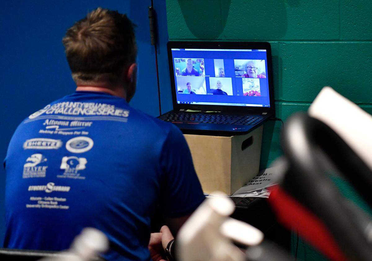 Josh Cone chats with members of his Zoom exercise class after they completed their work out on Tuesday, Feb. 2, 2021.