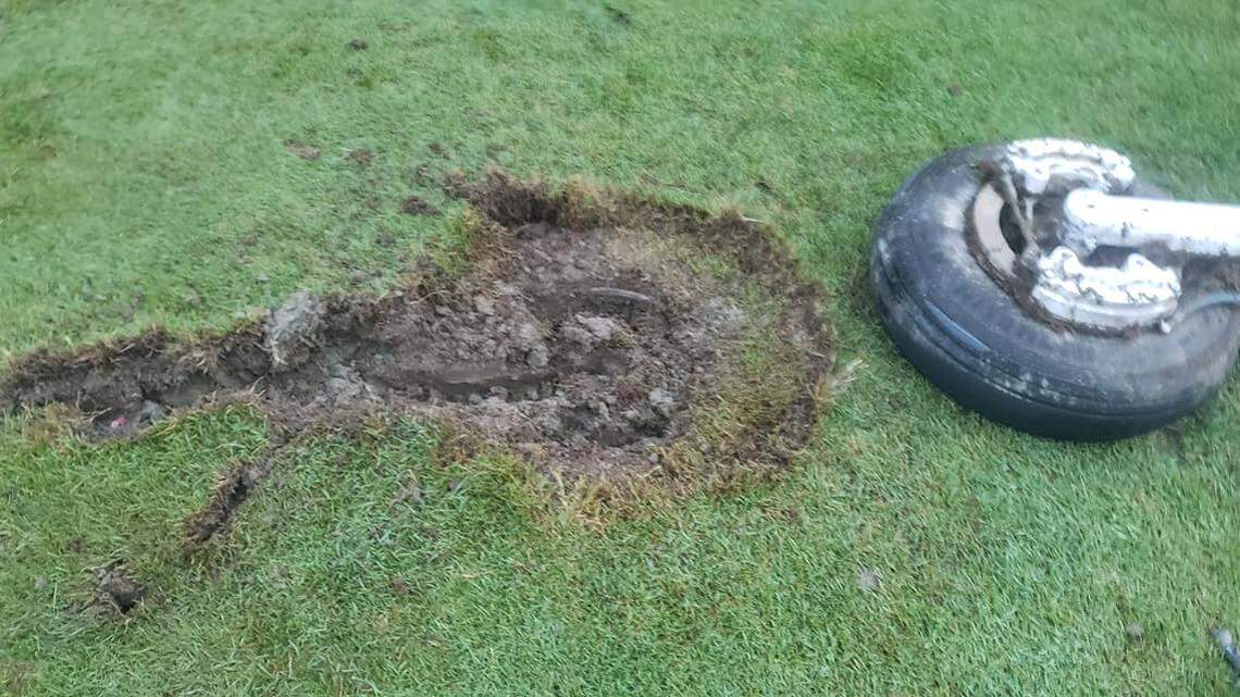 Part of the landing gear that fell from a plane over Maine landed on a fairway at a country club in the town of Gorham. The pilot landed safely at a New York airport.