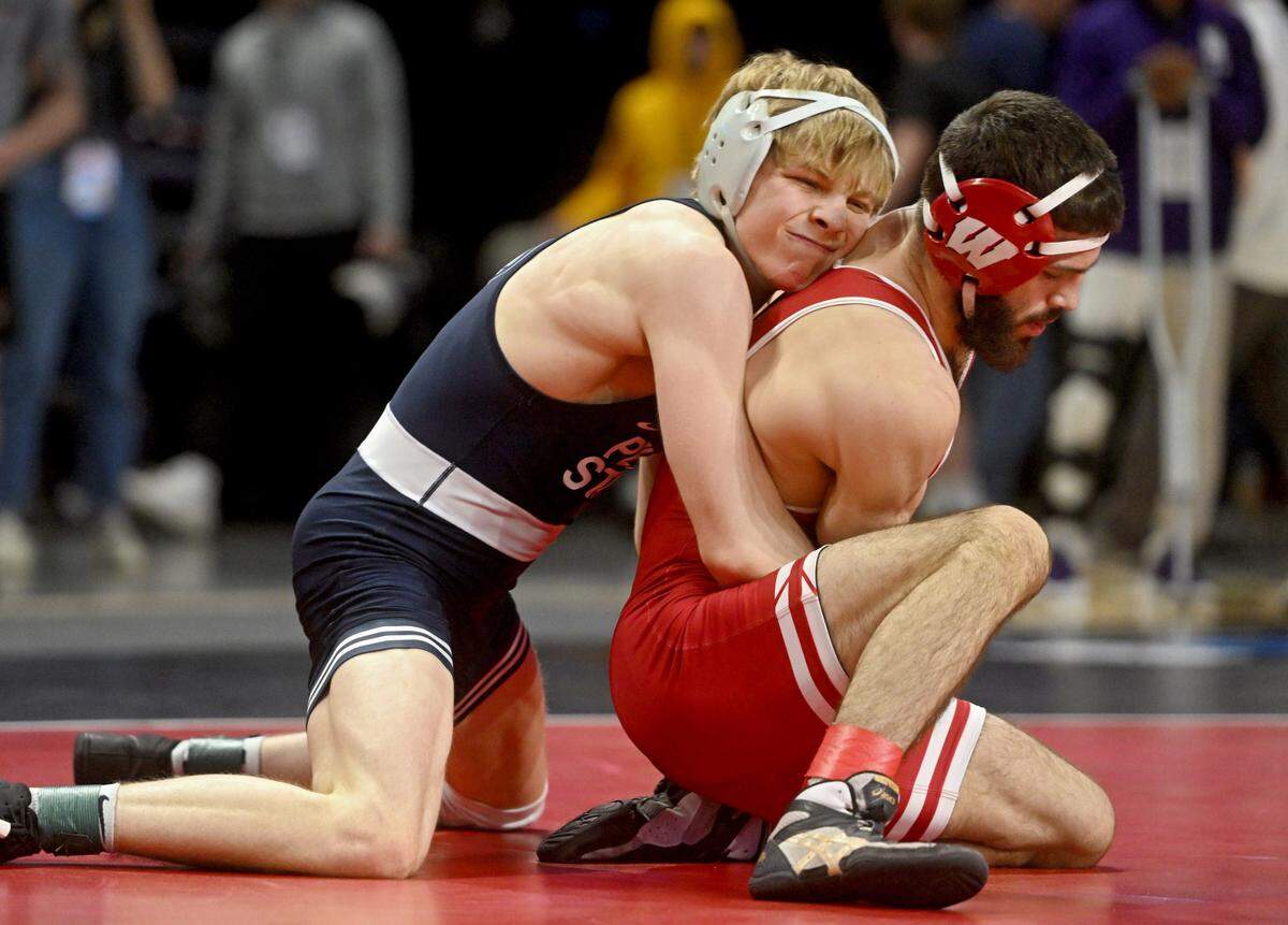 Braeden Davis controls Wisconsin’s Eric Barnett in a 125 lb quarterfinal match of the Big Ten Wresting Championships at the Xfinity Center at the University of Maryland on Saturday, March 9, 2024.