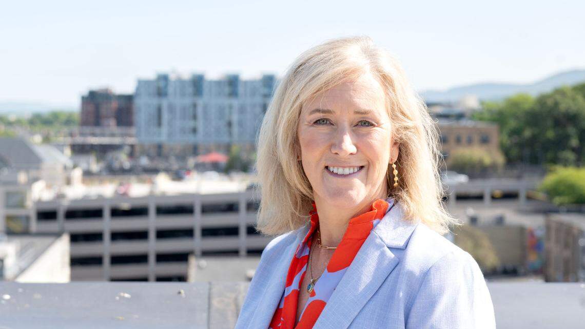 Downtown State College Improvement District’s new retail and commercial business advocate Kendra Kielbasa poses for a photo with downtown behind her on Tuesday, Sept. 3, 2024.