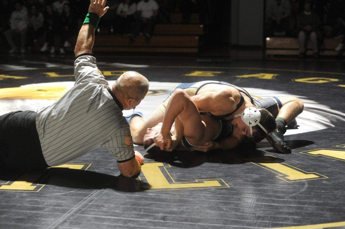 Bald Eagle Area’s Matthew Knepp looks to pin Philipsburg-Osecola’s Andrew Hensal in their 215-pound bout during the Eagles’ 47-15 win on Thursday, Jan. 6, 2022.