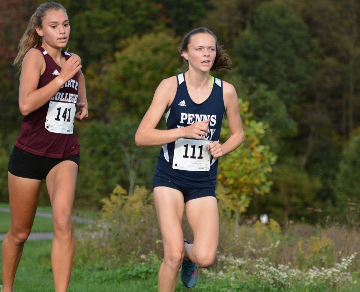 Penns Valley’s Anna Stitzer leads State High’s Marlee Kwasnica at their cross country meet on Monday, Oc.t 11, 2021 at Circleville Park.