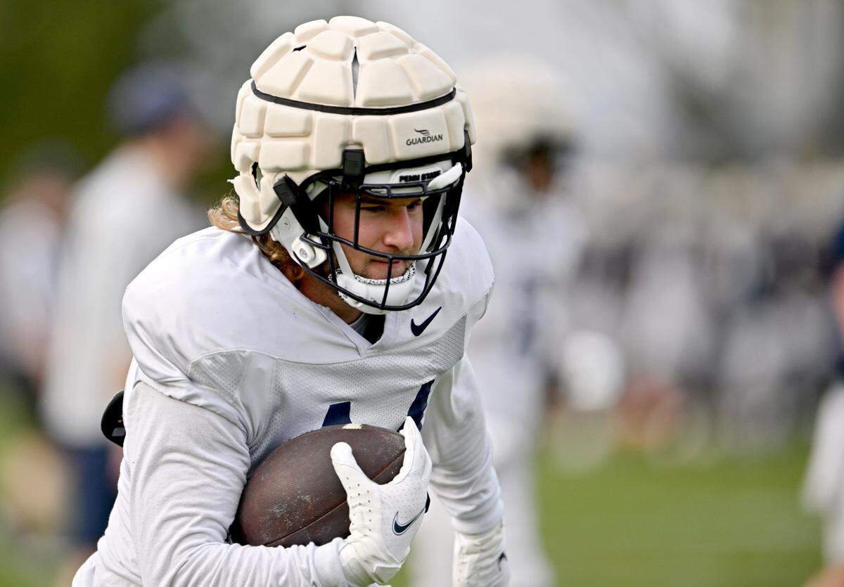 Penn State tight end Tyler Warren makes a catch and runs with the ball during a spring practice on Tuesday, April 9, 2024.