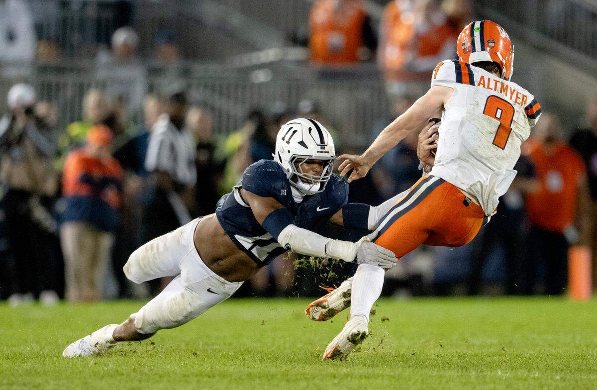 Penn State defensive end Abdul Carter trips up Illinois quarterback Luke Altmyer during the game on Saturday, Sept. 28, 2024.