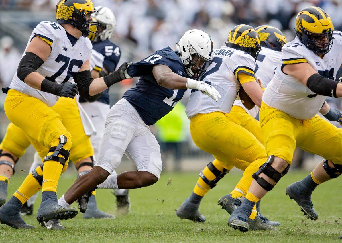 Penn State defensive end Arnold Ebiketie sacks Michigan quarterback Cade McNamara during the game on Saturday, Nov. 13, 2021.