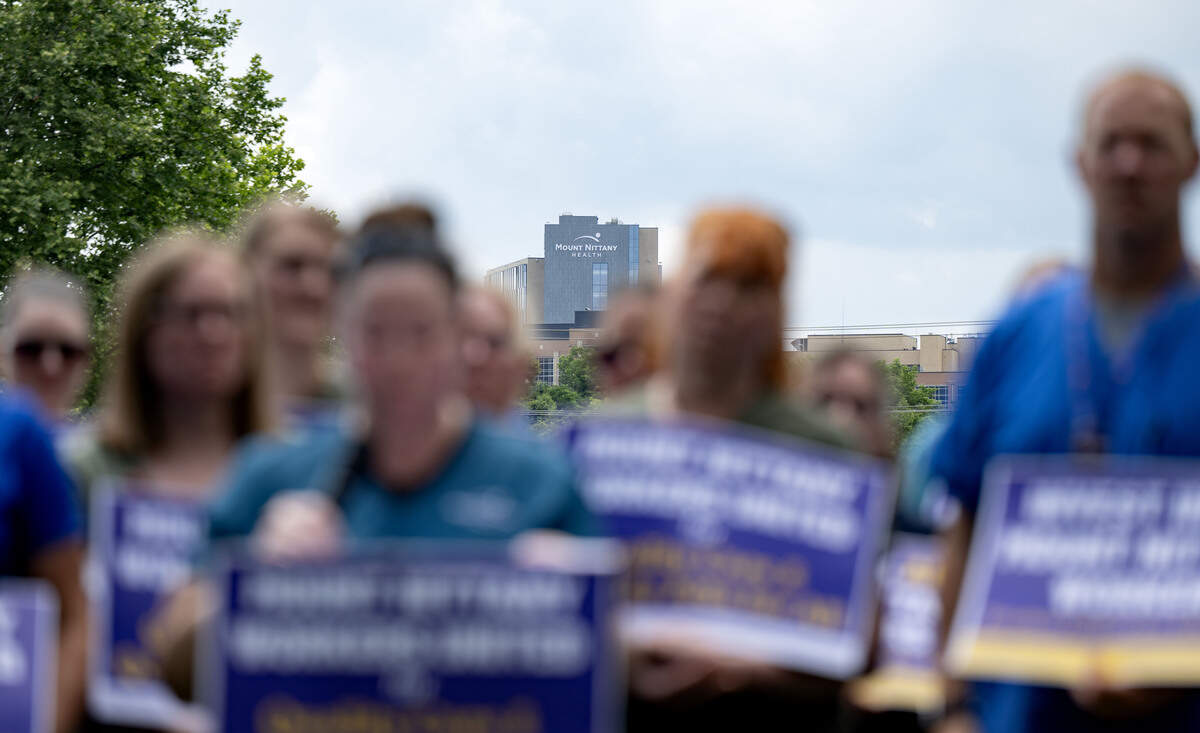 Mount Nittany Medical Center is seen in the distance as unionized workers gathered to announce a strike on Thursday, July 9, 2026.