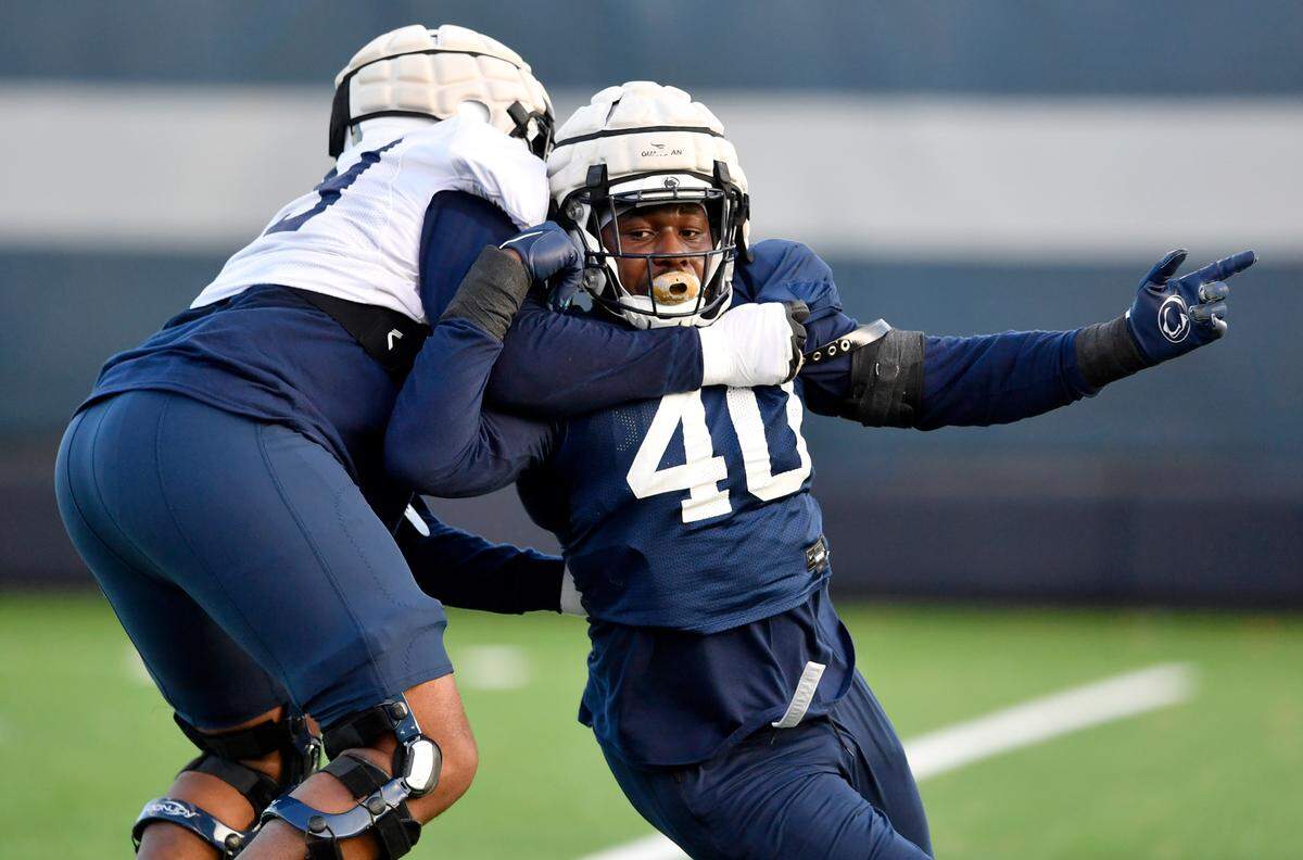 Penn State linebacker Jesse Luketa pushes around a teammate during practice on Wednesday, Nov. 24, 2021.