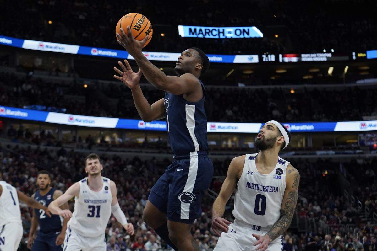 Northwestern Wildcats guard Boo Buie (0) defends Penn State Nittany Lions guard Kanye Clary (0) during the second half at United Center.