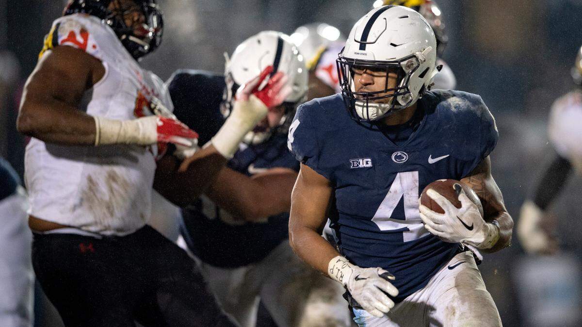 Maryland defenders can’t stop Penn State running back Ricky Slade as he scores his second touchdown of the game during the game on Saturday, Nov.  24, 2018.  