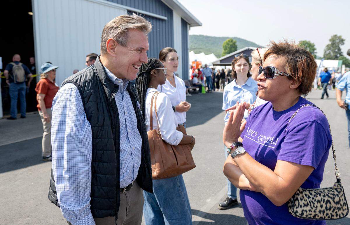 Rep. Paul Takac talks with visitors at at Penn State’s Ag Progress Days on Wednesday, Aug. 14, 2024.