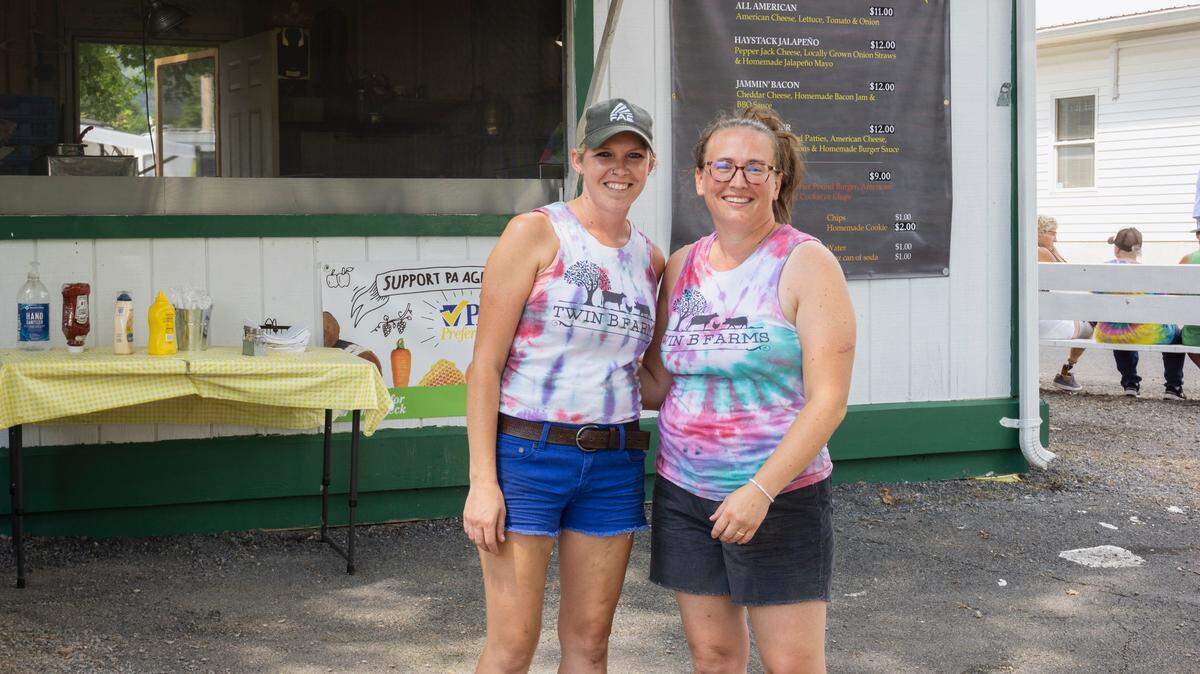 Skylar Diehl, left, and Kacee Burke run the popular Twin B Farms Gourmet Hamburger stand at the Centre County Grange Encampment and Fair and will soon launch a food truck.