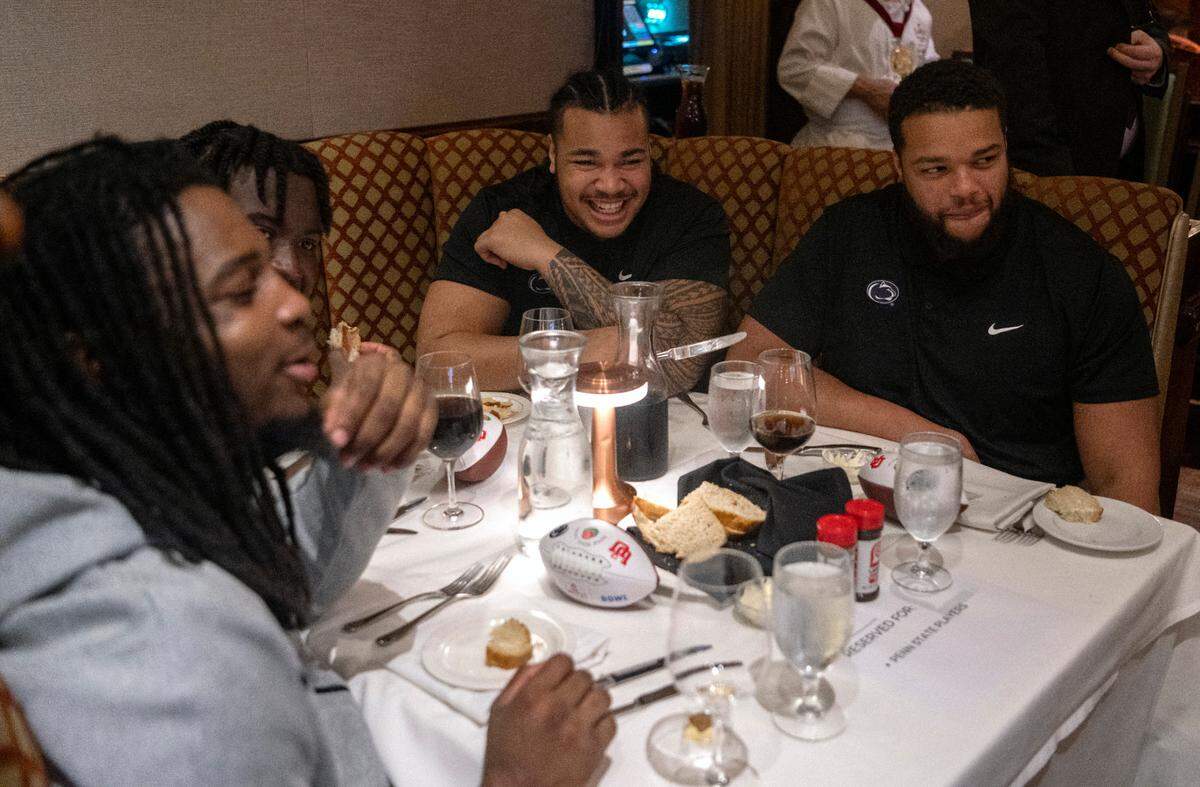 Penn State defensive tackles Dvon Ellies and PJ Mustipher laugh together at the Lawry’s Beef Bowl on Friday, Dec. 30, 2022.