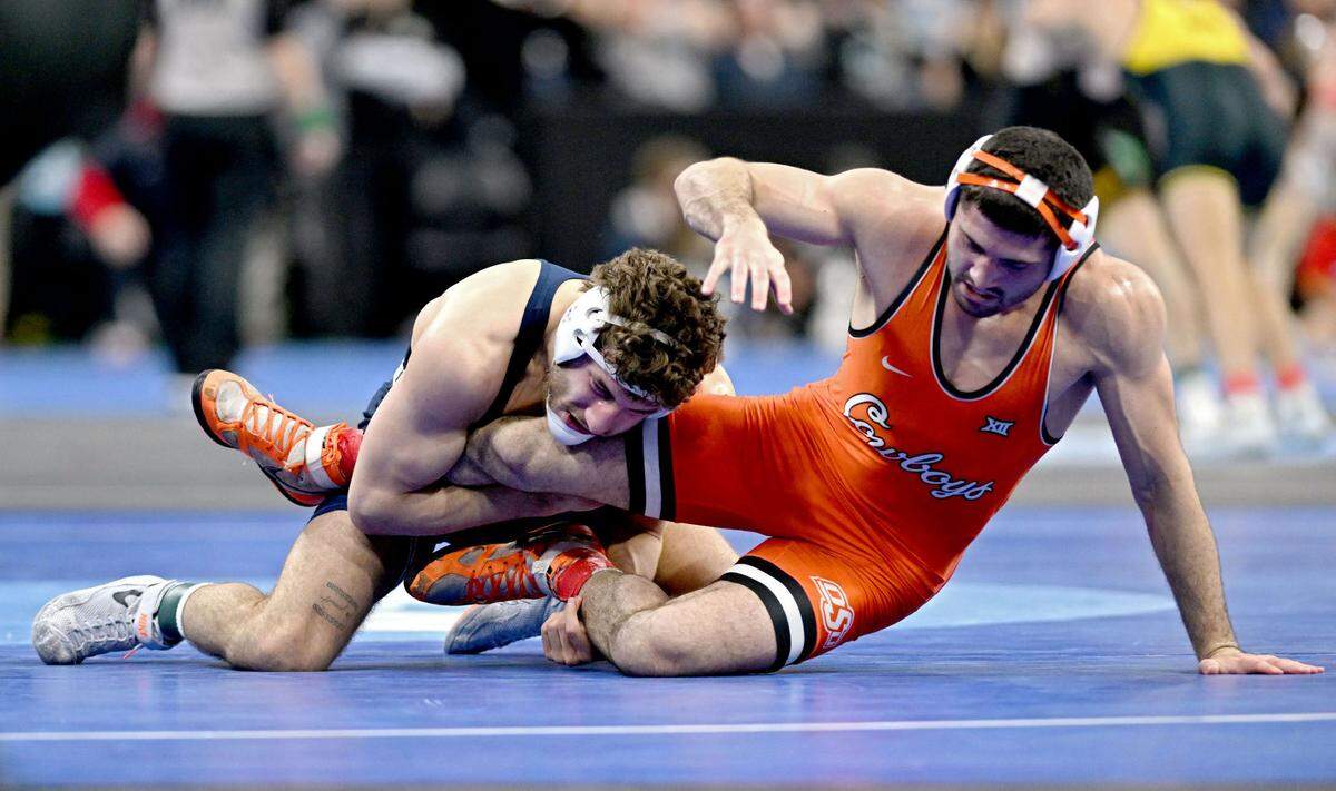 Penn State’s Mitchell Mesenbrink controls Oklahoma State’s Cameron Amine in a 165-pound quarterfinal bout during the 2025 NCAA Wrestling Championships in Philadelphia on Friday, March 21, 2025.