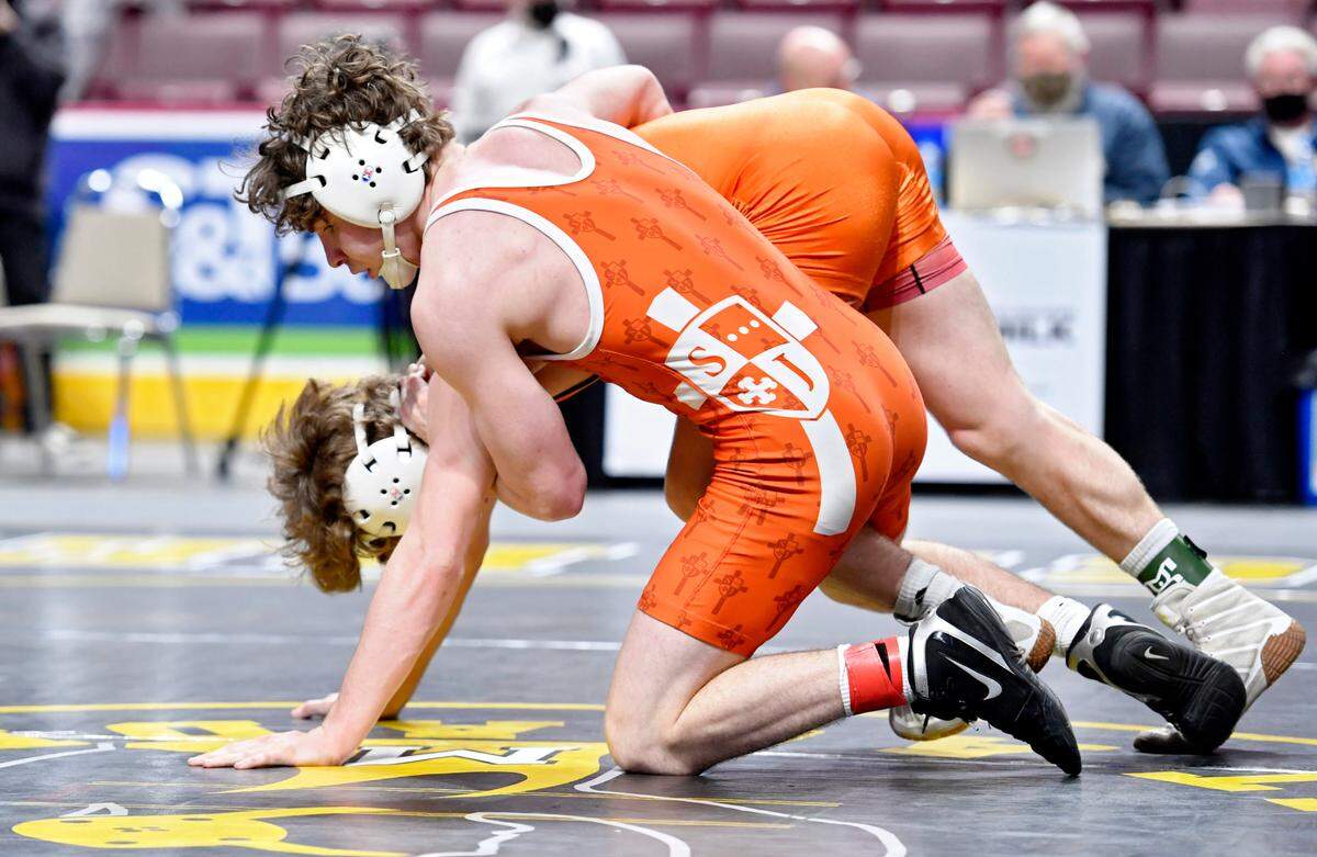 Saint Joseph’s Zack Witmer controls Harbor Creek’s Connor Pierce in the 133 lb third place bout at the PIAA AA wrestling championships on Friday, March 12, 2021 at the Hershey Giant Center. Witmer won by decision, 4-0.