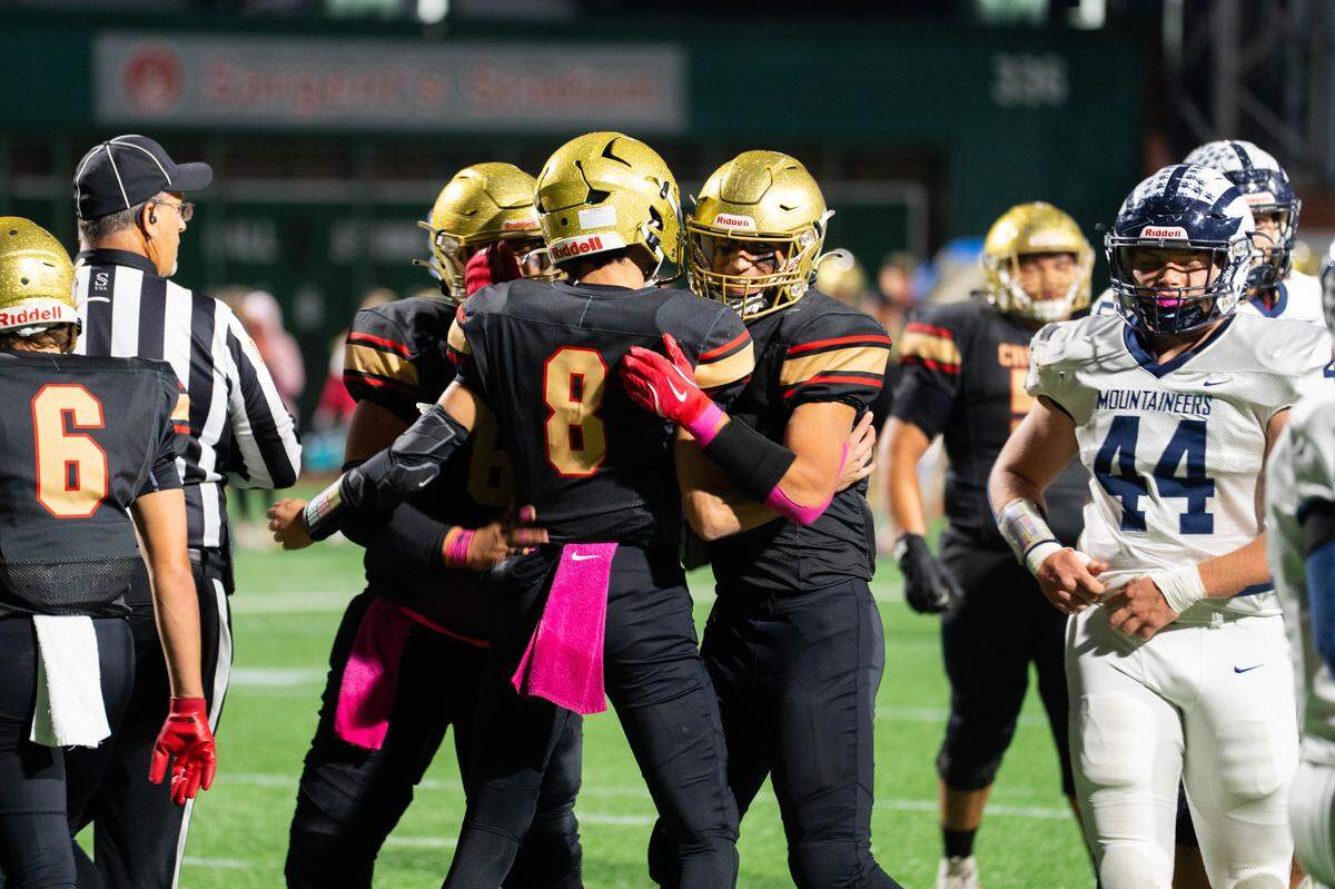 Bishop McCourt players celebrate after scoring a touchdown during a Friday night football game against Philipsburg-Osceola in Johnstown, Pa., on Oct. 10, 2025. The Crushers beat the Mountaineers 42-0.