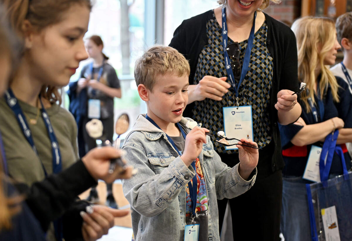 Bowie Snead, 11, samples four flavors of Penn State Berkey Creamery ice cream during Penn State’s Bring Our Children to Work Day on Monday, April 13, 2026.  