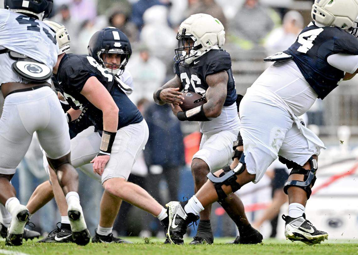 Penn State running back Cam Wallace cuts past defenders during Blue-White Practice on Saturday, April 25, 2026.  