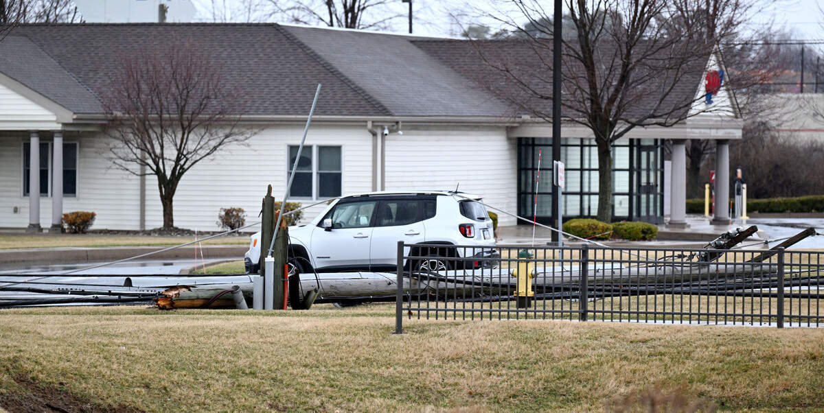 An SUV on Shiloh Road with wires over it after Sunday’s severe storm.