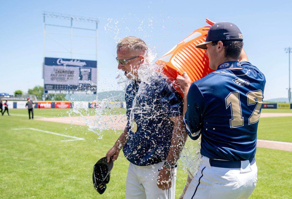 Players dump water on Bald Eagle Area coach James Gardner after the win over Tri-Valley in the PIAA 2A championship game at Medlar Field on Thursday, June 13, 2024.