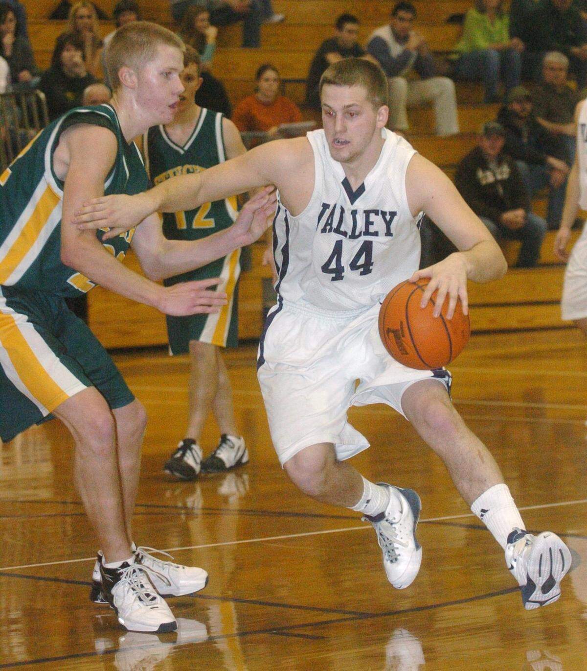 Penns Valley’s Jesse DeLoof (44) drives to the basket against Marion Center’s Mike Lockhart, left, during their District 6 AA quarterfinal game on Thursday, Feb. 19, 2009.