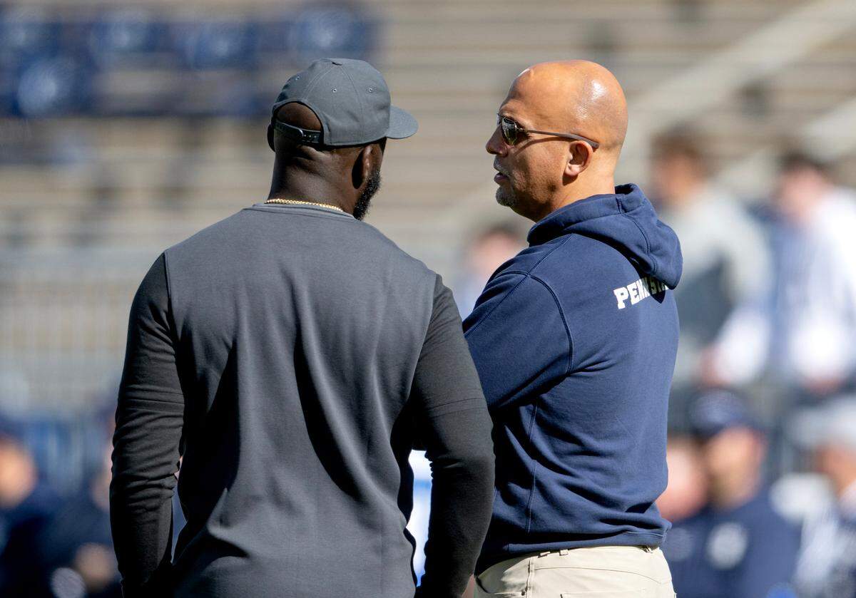 Penn State football coach James Franklin talks to UCLA coach DeShaun Foster before the game on Saturday, Oct. 5, 2024 at Beaver Stadium.