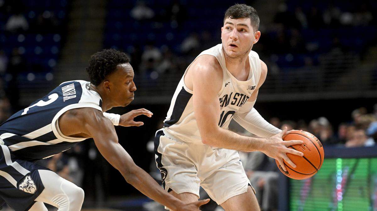 Penn State’s Andrew Funk dribbles around Butler’s Eric Hunter Jr. during their game on Nov. 14. Funk finished with 14 points Tuesday during the Nittany Lions’ 101-94 loss to Clemson in double overtime.