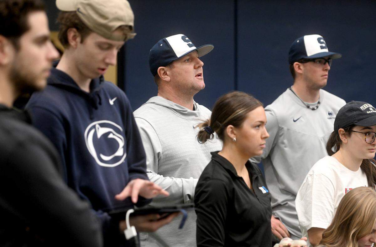 Penn State baseball assistant coach Josh Newman calls out to players during practice as student managers track each pitch on Thursday, Feb. 9, 2023 in Holuba Hall.