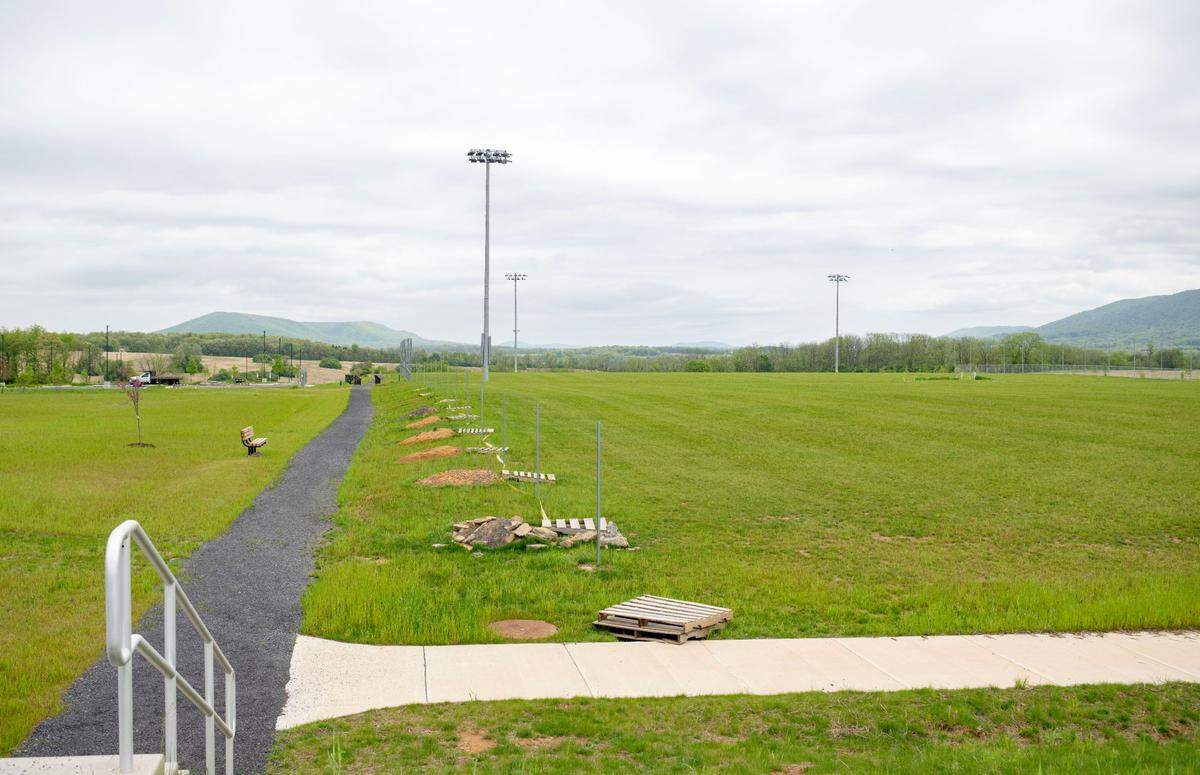 Fences are still being installed around the premiere fields at Whitehall Road Regional Park on Tuesday.
