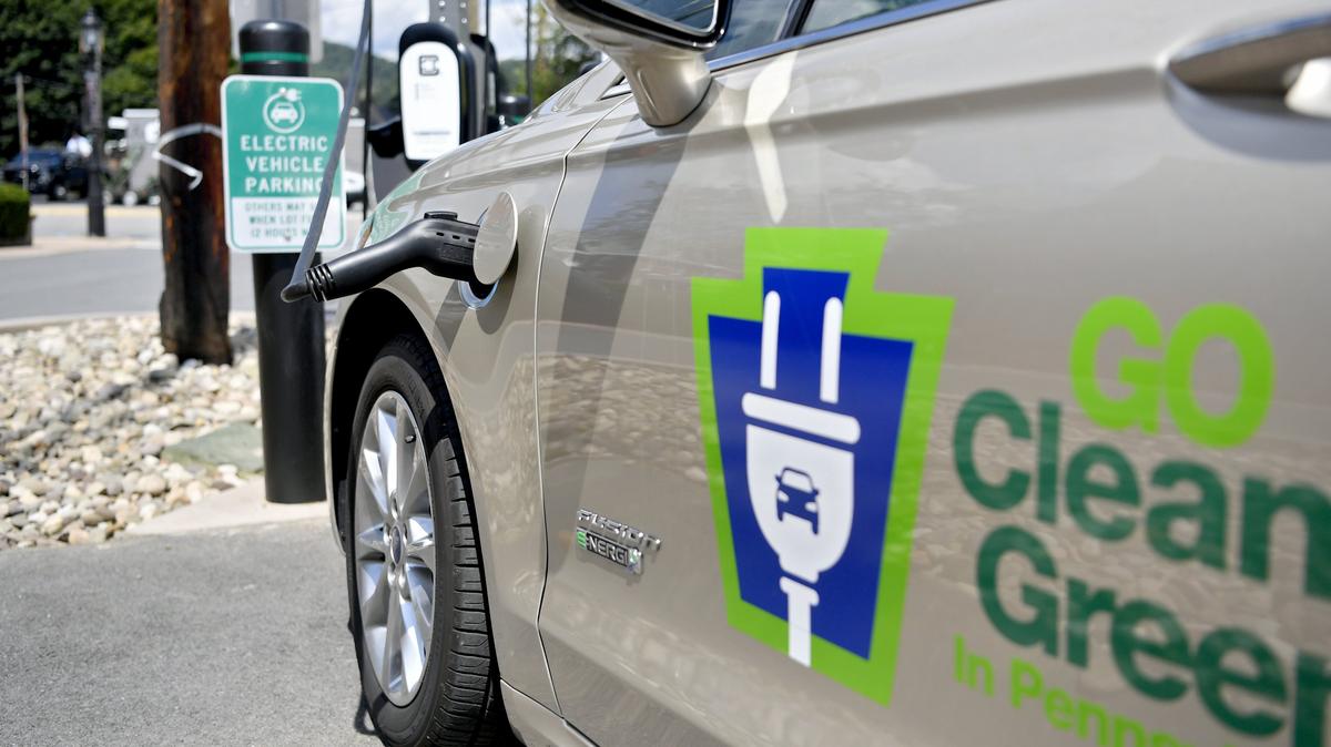 An electric Ford Fusion is plugged in to charge at an electric vehicle spots in Bellefonte on Friday, August 9, 2019.
