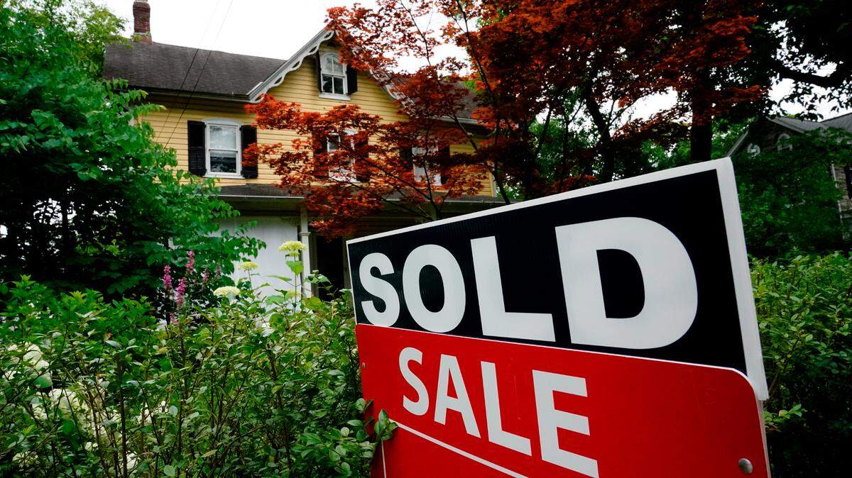 A sale sign stands outside a home in this file photo. The median home sale price in Lexington fell from June to July, according to real estate firm Redfin. (AP Photo/Matt Rourke)