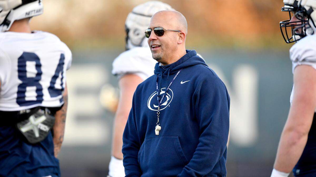 Penn State football coach James Franklin talks to offensive line players during practice on Wednesday, Nov. 24, 2021.