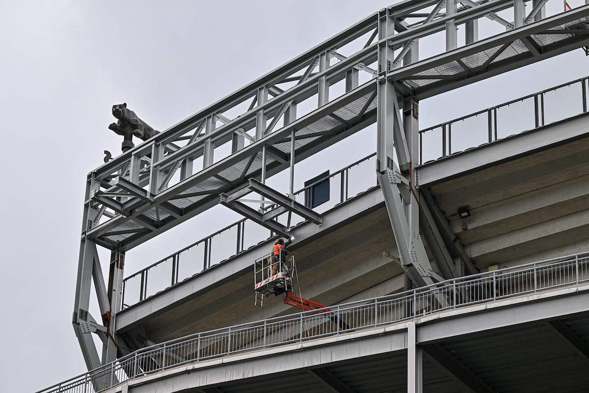 A welder works on the super ribbon board structure in the south end zone. The super ribbon board is a new addition to Beaver Stadium as part of the $700 million renovation. It will be unveiled during the 2024 home season.