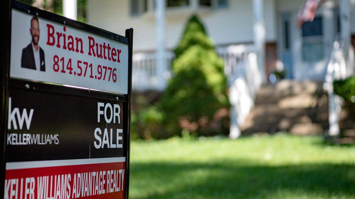 A “For Sale” sign in-front of a home on Pickwick Avenue.