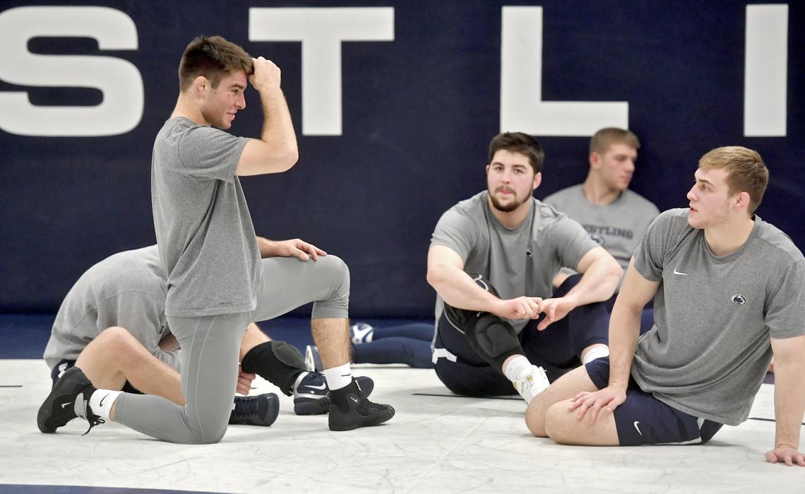 Penn State wrestlers Joe Lee, Seth Nevills and Michael Beard chat before practice on Tuesday, Nov. 5, 2019.