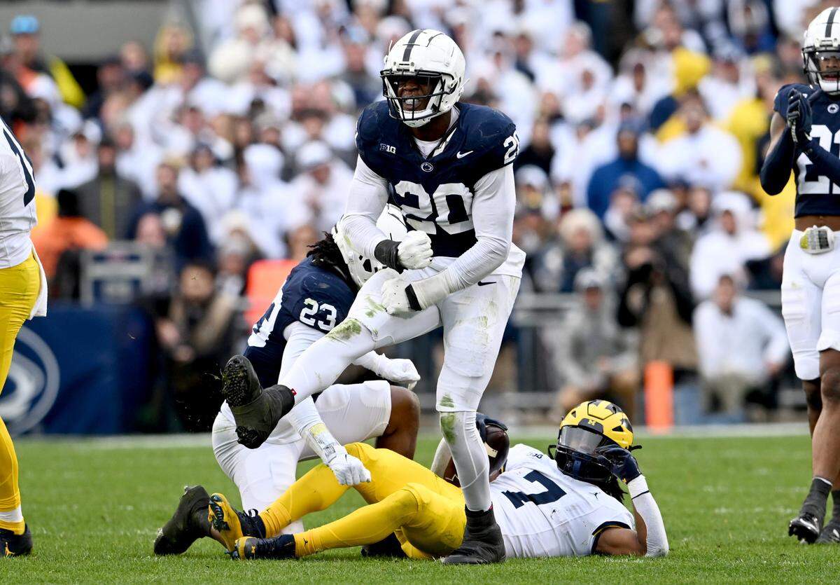 Penn State defensive end Adisa Isaac celebrates his stop of Michigan’s Donovan Edwards during the game against Michigan on Saturday, Nov. 11, 2023.