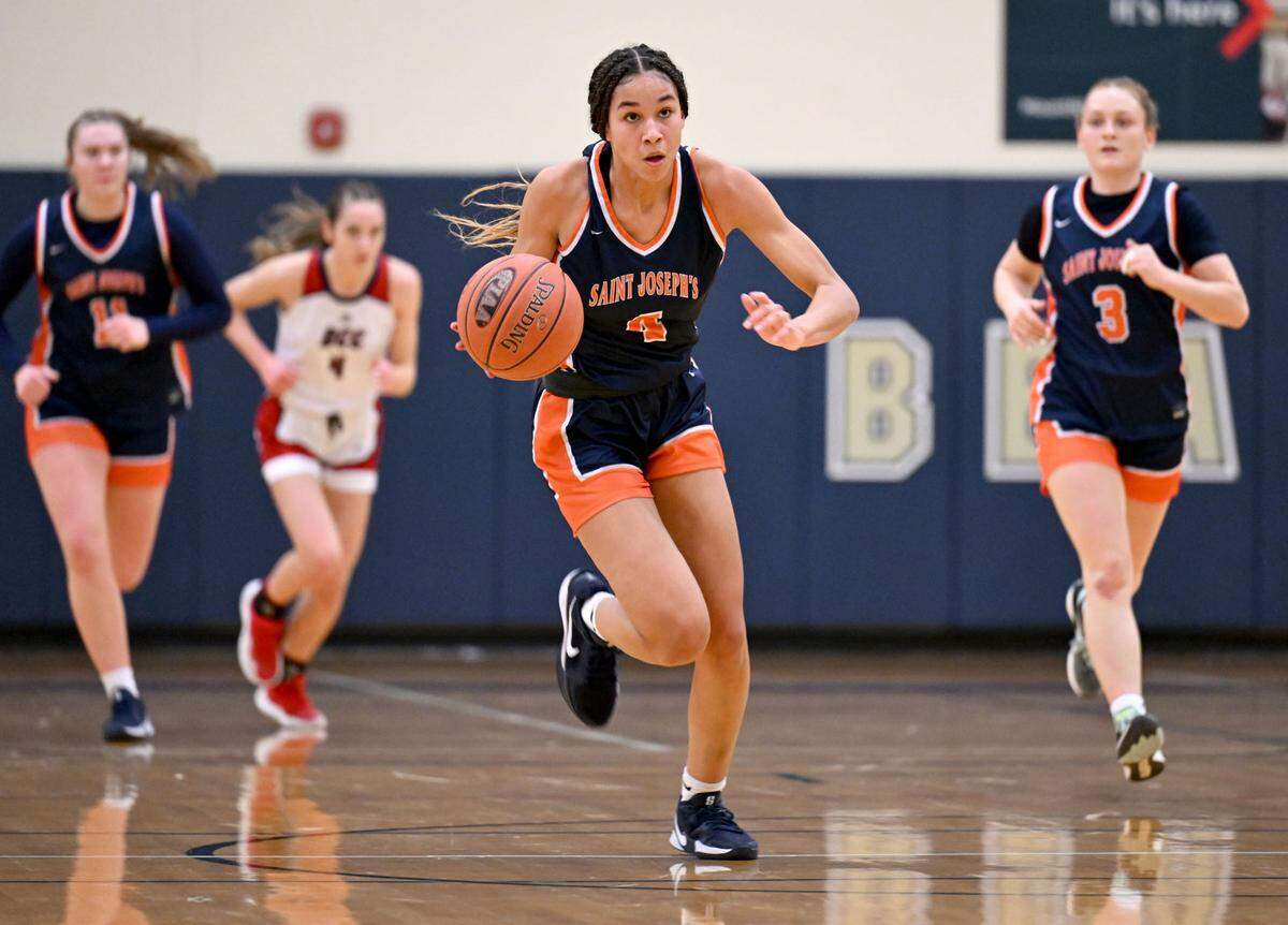 Saint Joseph’s Catholic Academy’s Jacee Cunningham takes off down the court with the ball during the game against DuBois Central Catholic on Wednesday, March, 12, 2025 at Bald Eagle Area High School.
