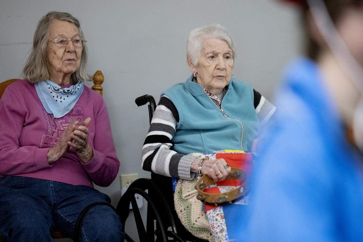 Shirley Reichard claps and Jennie Miller plays the tambourine during square dancing at the Wynwood House in Centre Hall on Thursday, Oct. 30, 2025. 