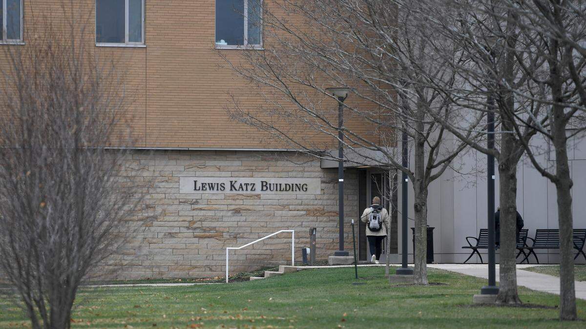 Students enter the Lewis Katz Building, which is home to Penn State Law, on the Penn State campus on Tuesday, Nov. 29, 2022. 