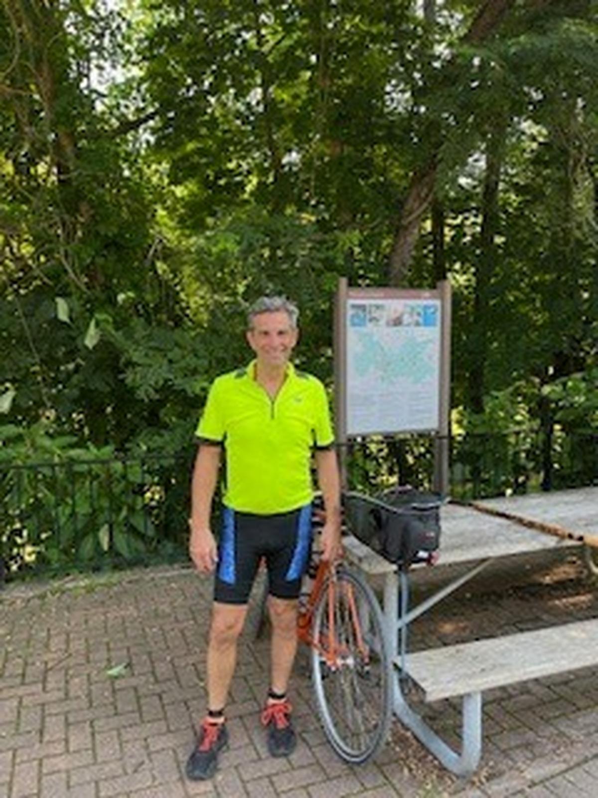 Marc Warren during a stop on his 150-mile ride in 2023.