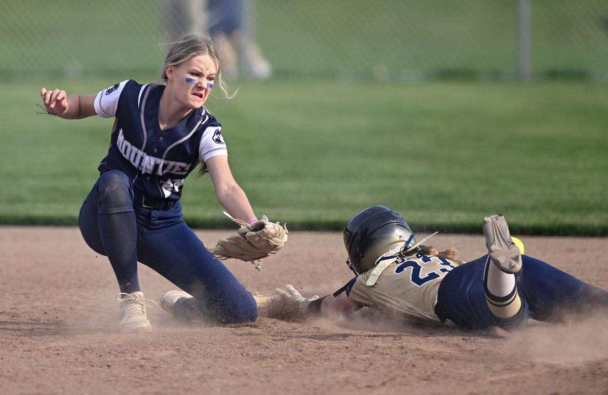 The ball bounces away from Philipsburg-Osceola’s Ashlynn Havens as Bald Eagle Area’s Kailey Echert safely slides to second during the game on Thursday, April 27, 2023.