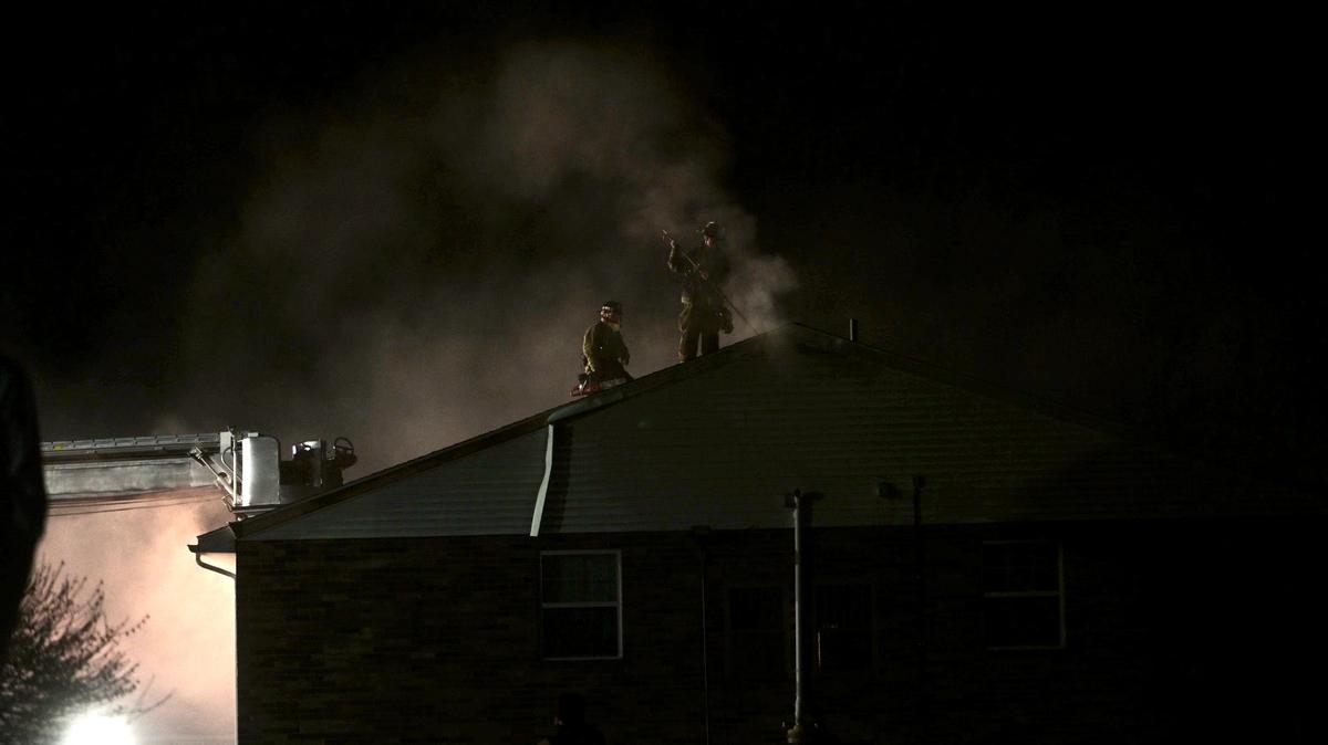 Firefighters work at the scene of an apartment fire at Vairo Village in Patton Township on Sunday, April 2, 2023.