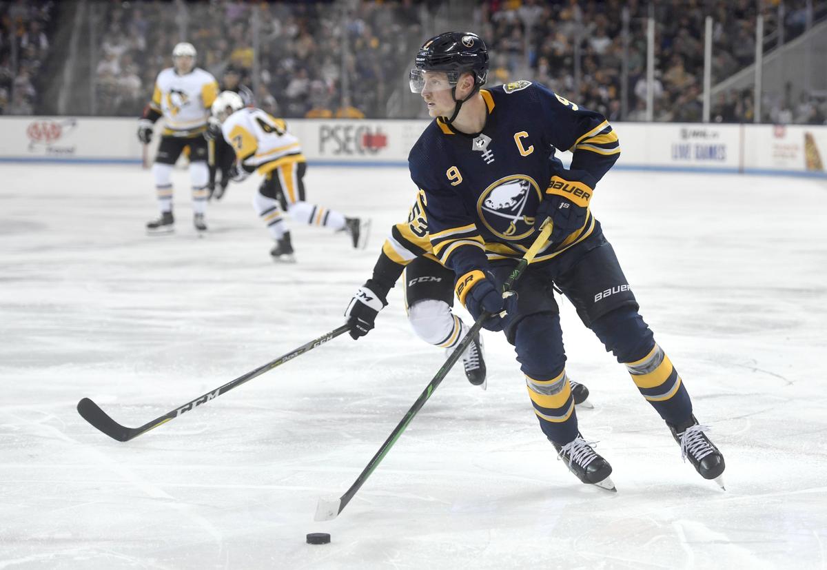 Buffalo Sabres’ Jack Eichel skates ahead of Pittsburgh Penguin defenders during the preseason game at Pegula Ice Arena on Monday Sept. 16, 2019.