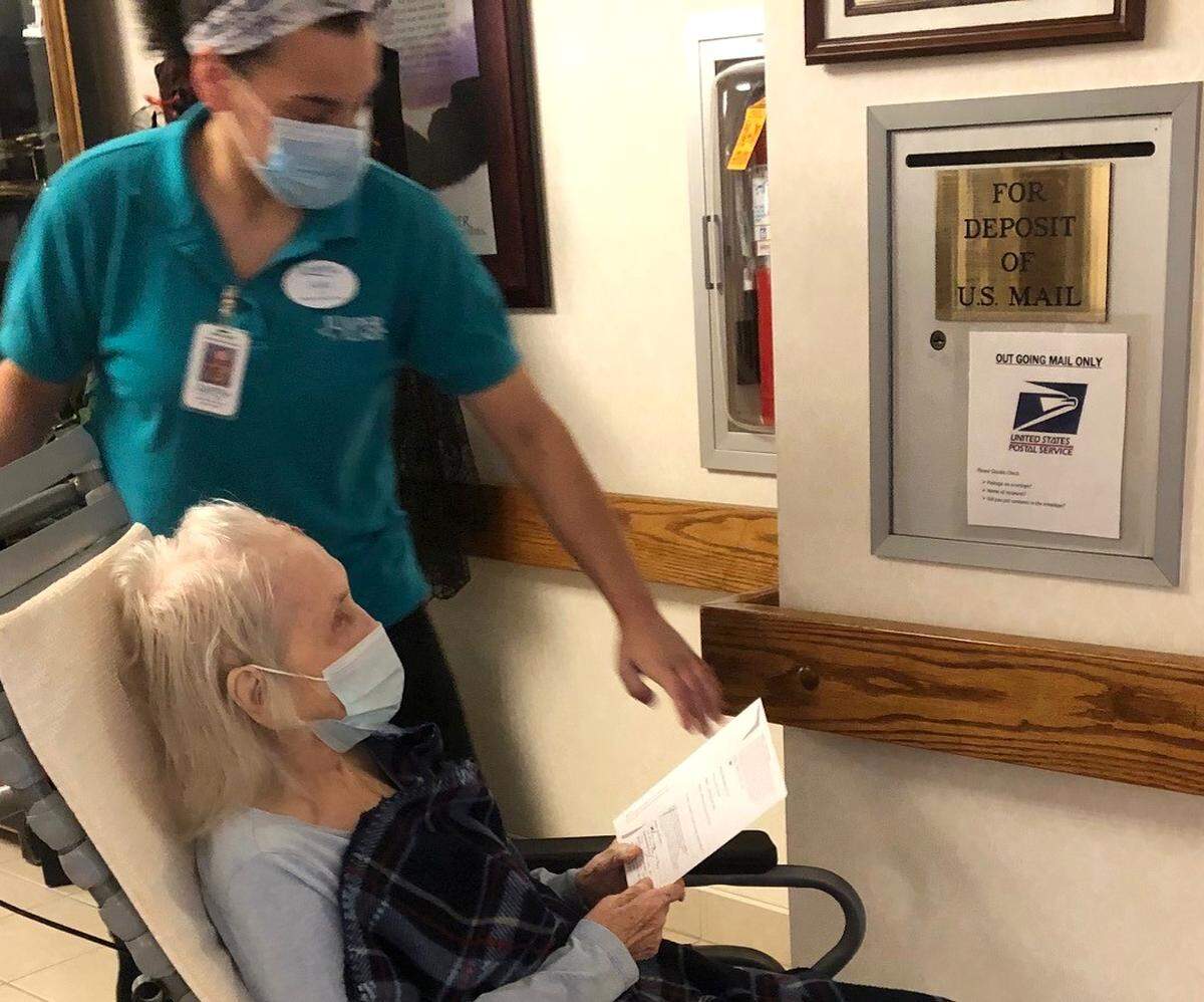 Juniper Village resident Bernadette Witzig, 99, cast her absentee ballot for the general election on Oct. 20. Witzig cast her first vote for a U.S. president in 1944 with a vote for Franklin Roosevelt. She has voted in 19 presidential elections since then, spanning over 76 years.