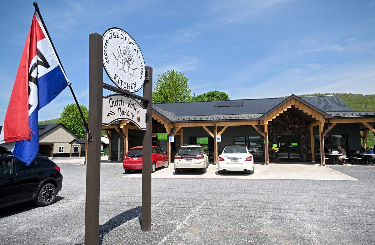 Customers dine on the porch at The Country Kitchen and Dutch Valley Bakery on Penns Valley Road on Friday, May 12, 2023.