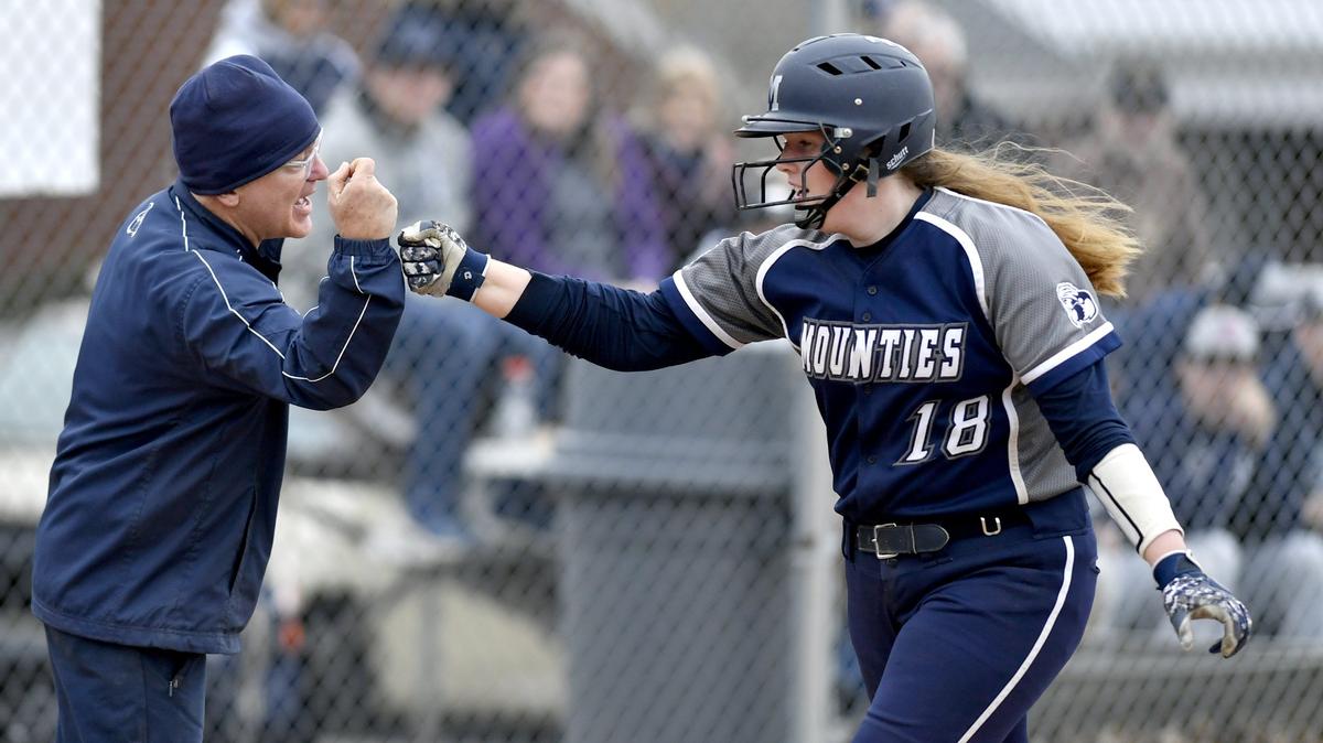 Philipsburg-Osceola’s Roselyn Weaver fist-bumps coach Jim Gonder as she rounds third from her homer during the game against Bald Eagle Area on Thursday, April 4, 2019.
