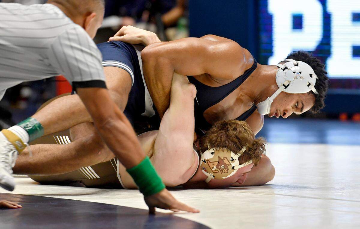 Penn State’s Carter Starocci controls Lehigh’s Jake Logan in the 174 lb bout during the match on Sunday, Dec. 5, 2021 at Rec Hall. Penn State won, 23-16.