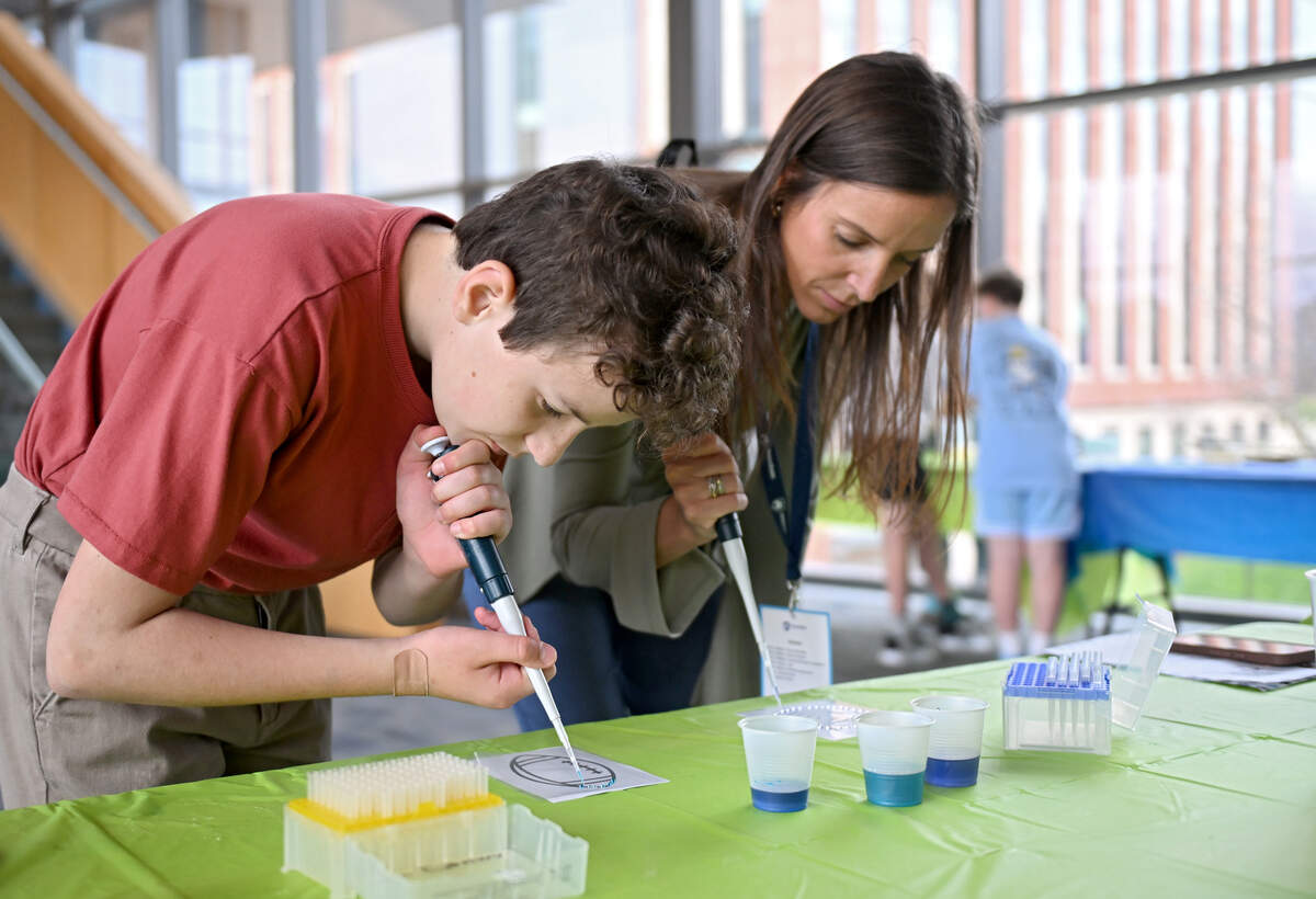 Quinn Ranio, 12, uses a pipette to make art at the One Health Microbiome Center during Penn State’s Bring Our Children to Work Day on Monday, April 13, 2026.