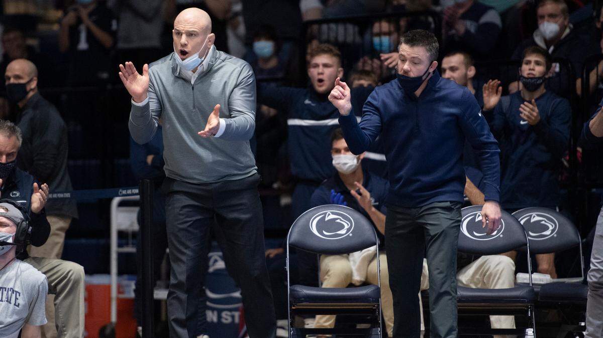 Penn State head coach Cael Sanderson (left), pictured in a dual from January 16, was able to get to 5-5 against Iowa as the Nittany Lions head coach after Penn State won 19-13 on Friday night.