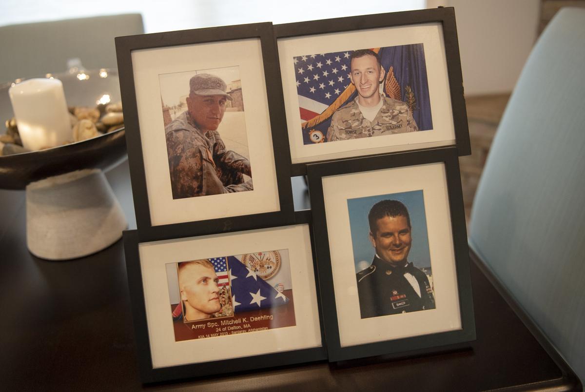 A photo collage of Spc. William Gilbert, Spc. Cody “Doc” Towse, Sgt. 1st Class Jeffrey Baker and Spc. Mitchell Daehling will be the first thing Sgt Adam Hartswick plans to hang in his new smart home.  The four men lost their lives the day in 2013 that Hartswick lost his legs.  