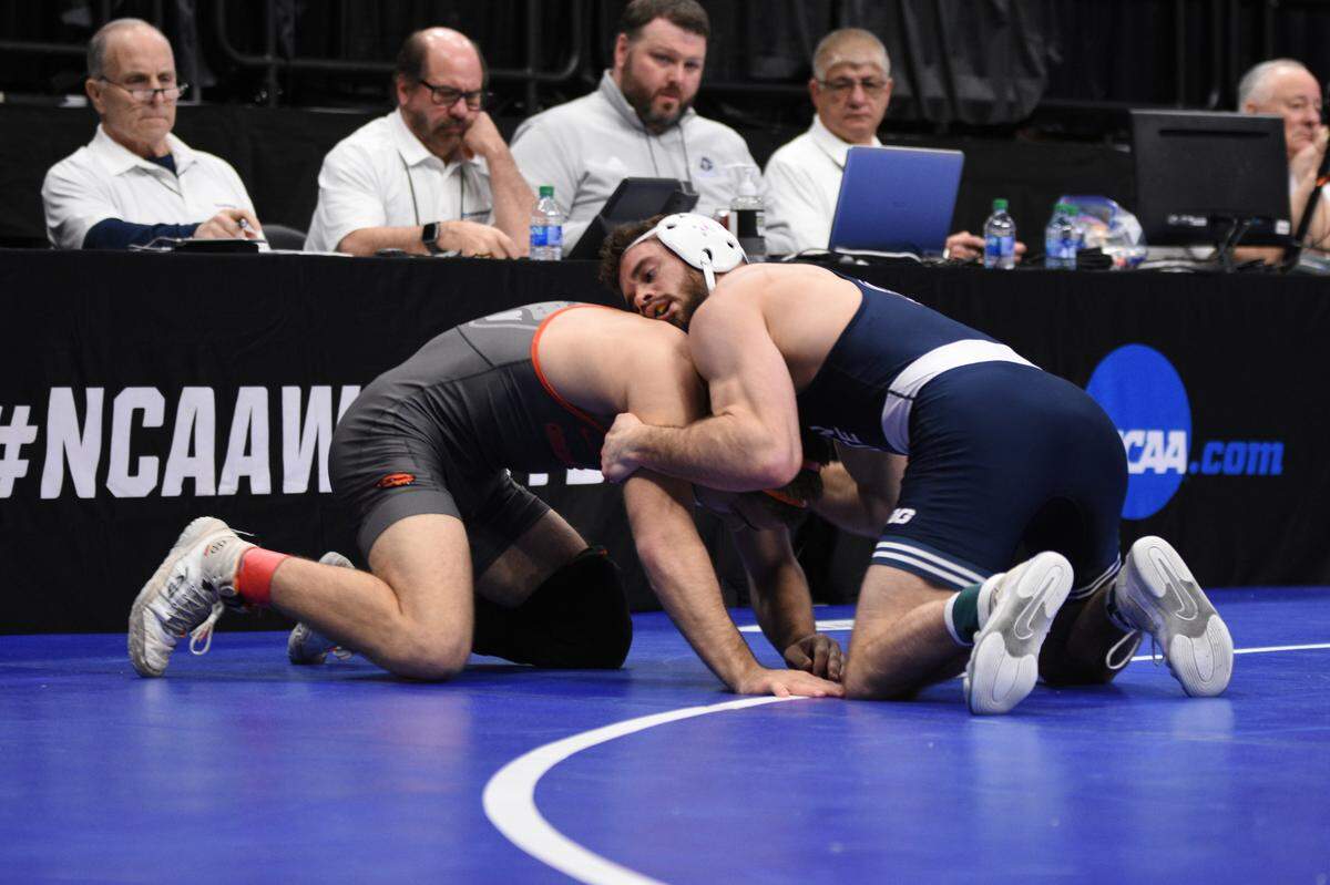 Penn State’s Brady Berge controls Oregon State’s Hunter Willits in their 157-pound first round match of the NCAA Championships on Thursday, March 17, 2022 at Little Caesar’s Arena in Detroit. Willits edged Berge, 2-1.